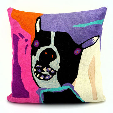A square woollen cushion printed with artwork of a dog by Karen Barnes.