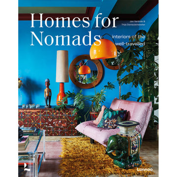 'Homes for Nomads' book cover featuring a photo of a living room with lots of bright colours and plants.