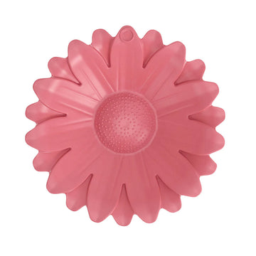 Top down view of a pink sunflower shaped bird bath.