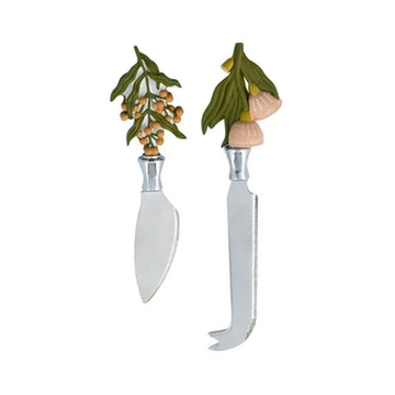 A 2 piece cheese knife set with gum leaves and blossoms on the handles.