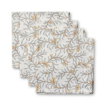 Set of four floral-patterned napkins on a white background.