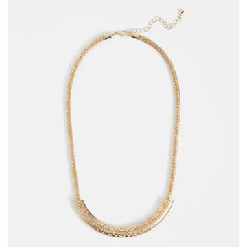 A gold mesh chain necklace with a long gold bar across the front with small circle cut outs.