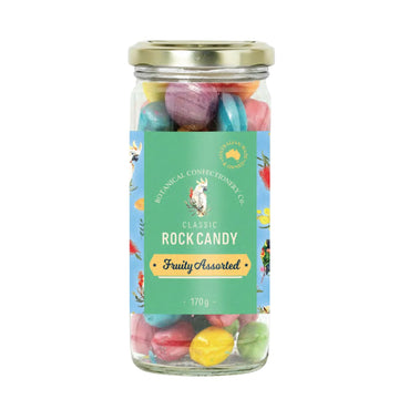 Jar of colorful rock candy with a label on a white background.