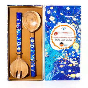 Wooden salad servers with blue handles in a box, next to a decorative box cover.