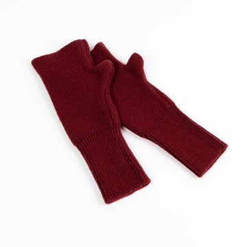 Pair of red fingerless gloves on a white background