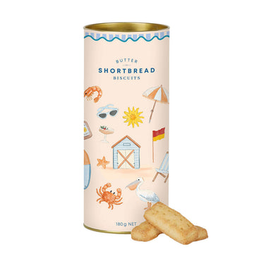 Butter shortbread biscuits in a decorative can with beach-themed illustrations on a white background.