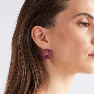 An image of a green hooped stud.