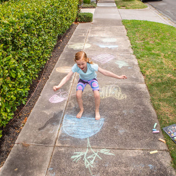 A black box titled 'Chalk it Up' with illustrations of games drawn in chalk including hopscotch and a bullseye. 