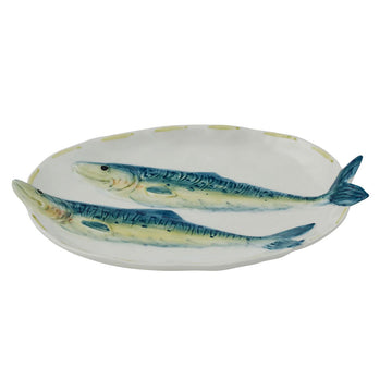 A ceramic plate with two embossed fish on the plate.