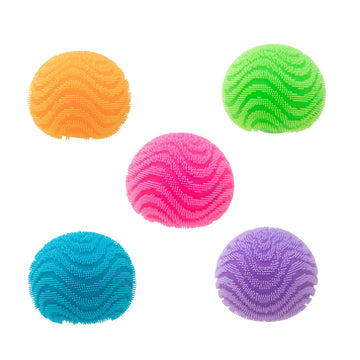 A cube box titled 'Nee Doh Fuzz Ball Wonder Waves' with a cut out showing the stress ball inside.