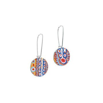 A pair of drop earrings with circles printed with artwork by Murdie Morris.