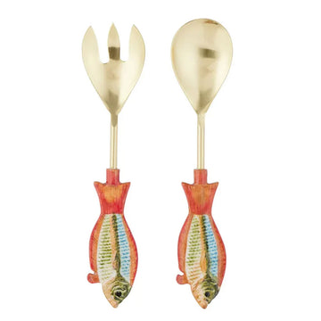 A pair of salad servers in gold with fish shaped handles.