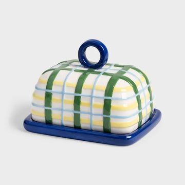 Butter dish with green and yellow plaid design on a white background.