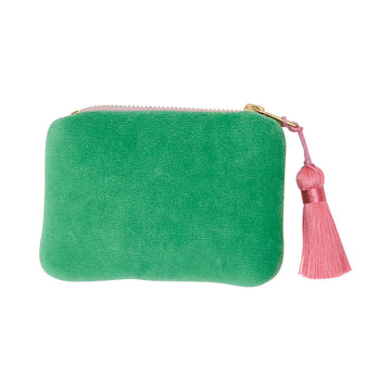 A velvet coin purse in green with a pink zipper and pink tassel. 