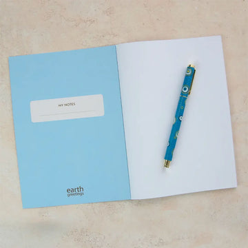 Front cover of a notebook with blue First Nations artwork.