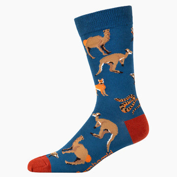 A blue sock with a red heel and toe and illustrated with kangaroos, camels, foxes and snakes.