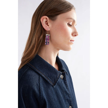 A pair of hoop earrings with a silver bar and beads hanging down making a check pattern in shades of purple.