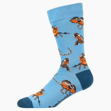 A light blue sock with a dark blue heel and toe and illustrated with frill neck lizards.
