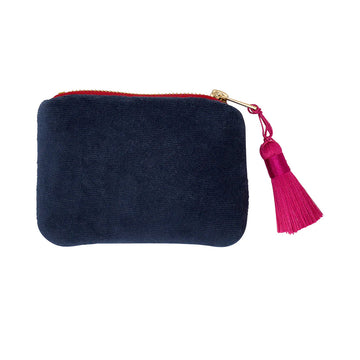 A dark blue velvet coin purse with a pink zip and tassel.