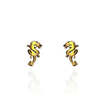 A pair of dragon shaped gold stud earrings.