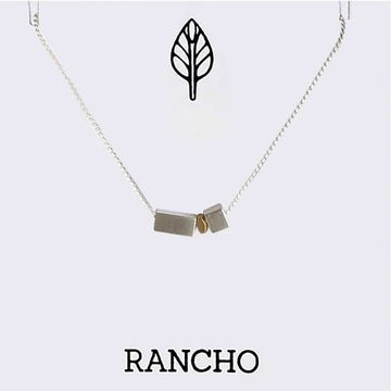 Necklace with geometric pendants on a white background, featuring the brand 'RANCHO'.