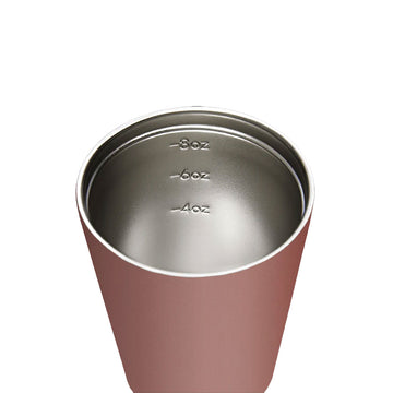 A reusable coffee cup in a tuscan brown colour with a black lid.