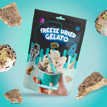 Packaged freeze-dried gelato with lamington flavour on a blue gradient background.