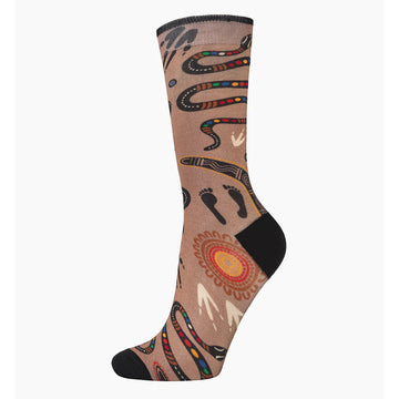A light brown sock with a black heel and toe and illustrated with Indigenous symbols including footprints, a snake, a boomerang and a sun.