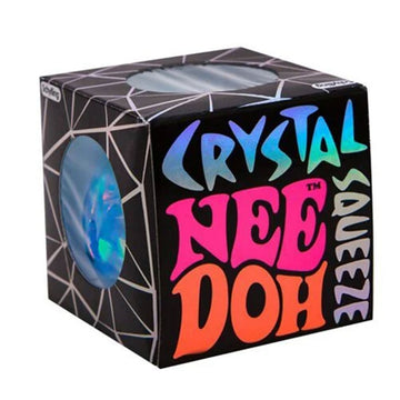 A black cube box with the text 'Crystal Nee Doh Squeeze' on one side.