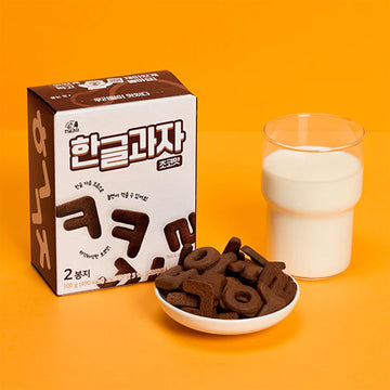 Box of Korean alphabet chocolate cookies on a purple background.