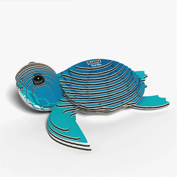 Blue turtle-shaped cardboard model on a white background.