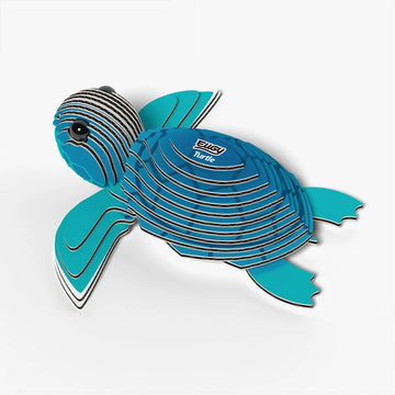 Blue turtle-shaped cardboard model on a white background.