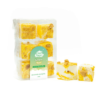 A packet of lemon tart flavoured marshmallows with two marshmallows next to the packet.