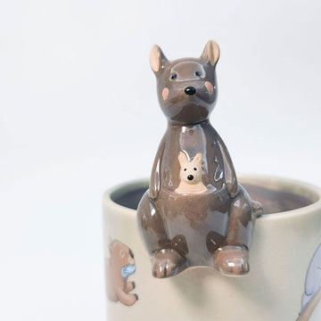 Ceramic kangaroo-shaped sculpture on a white background.