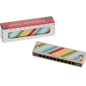 A wooden harmonica with colourful stripes is picture both inside and outside a box.