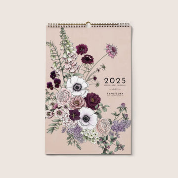 Front view of a spiral bound calendar with an illustration of flowers.