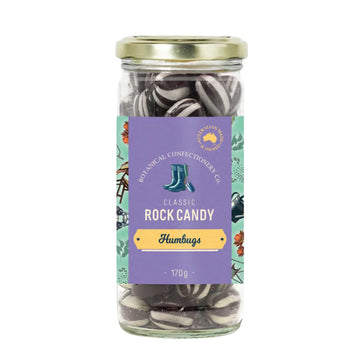 Jar of rock candy with a colorful label on a white background