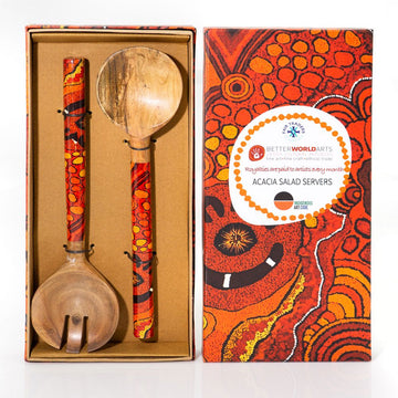 Wooden salad servers with colorful handles in a decorative box, featuring Better World Arts branding.