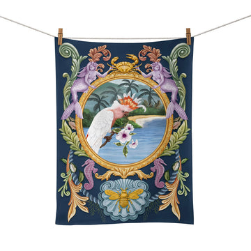 A tea towel illustrated with a Major Mitchell cockatoo with a border of seahorses and mermaids.