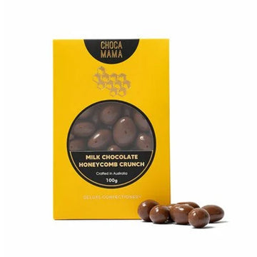 A yellow box with a cut out window showing chocolate covered honeycomb inside.