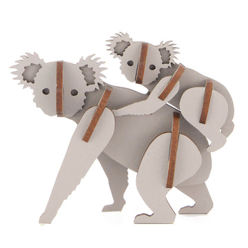 A koala and joey on its back made from laser cut wood slotted together to make a 3D shape.