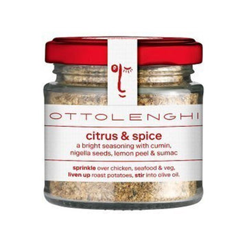 A jar filled with spices and a white product label around the jar with a red lid.