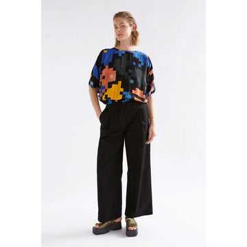 Colorful pixelated top on a white background.