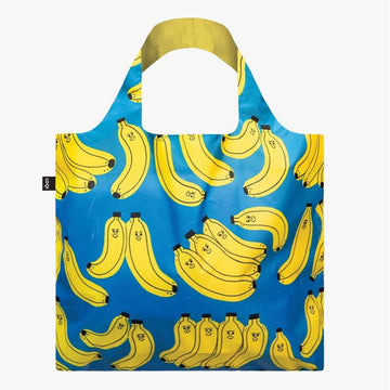 A reusable shopper bag in blue illustrated with bananas with smiley faces by Tess Smith Roberts.