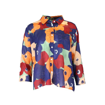 A women's shirt printed with a colourful floral design.