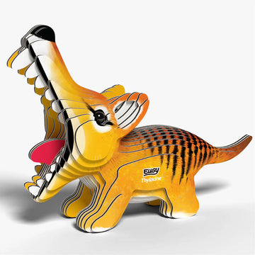 Toy cardboard model of a thylacine on a white background.