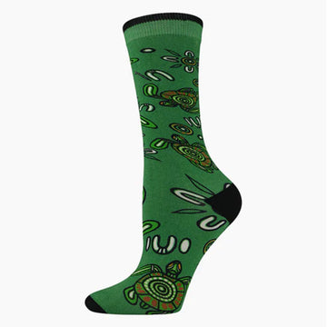 A green sock with a black heel and toe and illustrated with turtles.