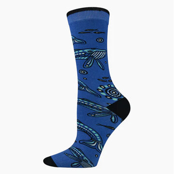 A dark blue sock with a black heel and toe illustrated with whales.