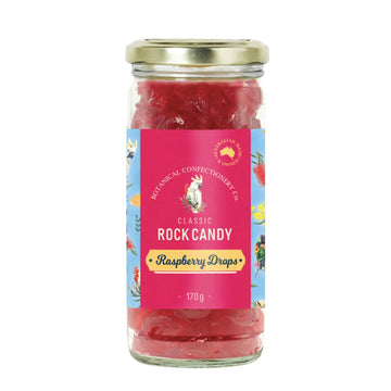 Jar of raspberry drops with a colorful label on a white background
