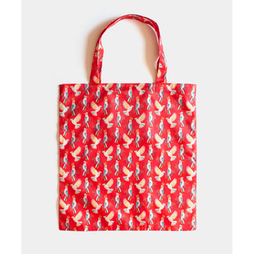 A reusable shopping bag in red illustrated with a repeat pattern of cockatoos.